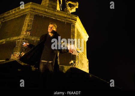Aberystwyth, Wales, UK. 15 Nov, 2015.   Aberystwyth university student Ross Payton speaking at an emotional candle-lit vigil on the steps of the town’s iconic war memorial,  in memory of all those killed in the Paris terrorist attacks of November 13 2015    photo Credit:  Keith Morris / Alamy Live News Stock Photo