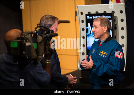 John Grunsfeld, associate administrator, science mission, NASA, is interviewed by media following a news briefing announcing the presence of water on Mars on Monday, September 28, 2015 at NASA Headquarters in Washington, DC. The findings are being presented this week at the European Planetary Science Congress in France and are detailed in a research paper titled, 'Spectral Evidence for Hydrated Salts in Seasonal Brine Flows on Mars.' Photo Credit: (NASA/Aubrey Gemignani) Stock Photo