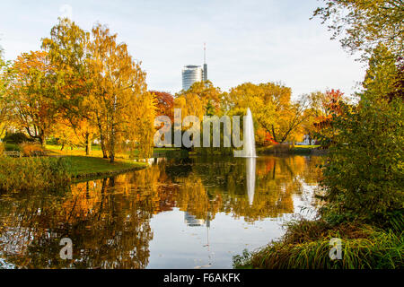 City park in Essen, Germany, pond and water fountain, RWE headquarter office tower building, Stock Photo