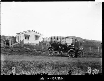 Model T Ford outside a farm house Stock Photo