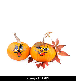 funny painted pumpkin with autumn leaves isolated on white Stock Photo