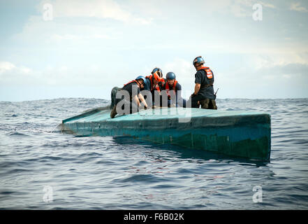 A Coast Guard Cutter Stratton boarding team member inspects the bridge of a self-propelled semi-submersible interdicted in international waters off the coast of Central America, July 19, 2015. The Stratton’s crew recovered more than six tons of cocaine from the 40-foot vessel. (Coast Guard photo courtesy of Petty Officer 2nd Class LaNola Stone) Stock Photo