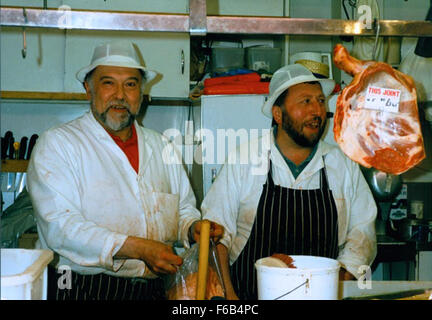 Jimmy Forsyth operating a butcher's stall at Grainger Market in Newcastle upon Tyne, presenting the market's traditional atmosphere and variety of meats. Stock Photo