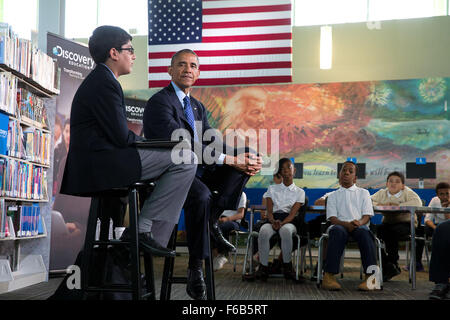 President Barack Obama is interviewed by 6th-grader Osman Yaya during the 'Of the People: Live from the White House' Virtual Field Trip series, at the Anacostia Neighborhood Library in Washington, D.C., April 30, 2015. Chuck Kennedy) Stock Photo