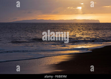 Niihau island in the Pacific Ocean viewed from Kauai's west coast at sunset Stock Photo