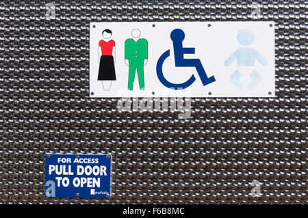 Signs on mixed sexes toilet door,High Street, Crowthorne, Berkshire, England, United Kingdom Stock Photo