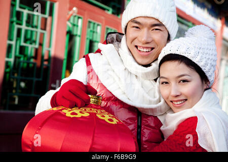 Young couple holding red lantern Stock Photo