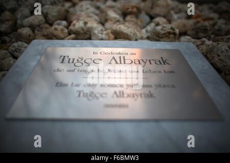 A memorial plaque for murdered student Tugce Albayrak written with 'In memory of Tugce Albayrak who died tragically' can be seen during a vigil in front of a McDonald's in Offenbach am Main, Germany, 15 November 2015. Tugce was violently attacked in the parking lot of the restaurant about a year ago. The young woman was beaten to the ground by an 18-year-old male and later fell into a coma. She passed away on her 23rd birthday without having regained consciousness. Photo: FREDRIK VON ERICHSEN/dpa Stock Photo