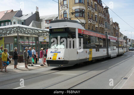 A Kusttram operated by De Lijn picks up passengers in De Panne before heading to Oostend and Knokke, a journey of over 2.5 hours Stock Photo