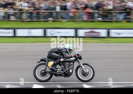Classic motorcycles racing at the Goodwood Revival on 13/09/2015 at Goodwood MotorCircuit, Chichester.  Bikes negotiate the chicane and enter the main straight. Picture by Julie Edwards/Photoshot Stock Photo