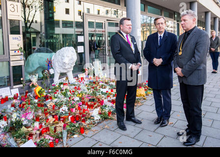 Munich, Germany. 16th Nov, 2015. Mayor of Munich Dieter Reiter (R) and Deputy Mayor Josef Schmid (L) speak before a Europe-wide minute of silence for the victims of the terror attacks in Paris with French consul general Jean-Claude Brunet in Munich, Germany, 16 November 2015. At least 129 people were killed and more then 350 critically injured in a series of overnight terror attacks in Paris from 13 to 14 November 2015. Photo: MARC MUELLER/dpa/Alamy Live News Stock Photo