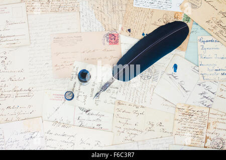 feather pen and antique letters Stock Photo