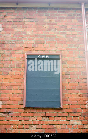 Great Western Railway (GWR) Notice board on wall of Staverton Railway Station in Devon, England Stock Photo