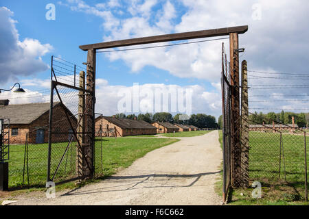 Fence and prisoner barracks in Auschwitz II-Birkenau German Nazi Concentration and Extermination Camp. Brzezinka Oswiecim Poland Stock Photo