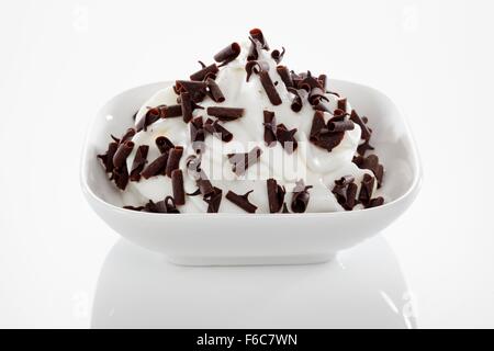 Yogurt ice cream garnished with chocolate curls Stock Photo