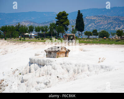 Ancient tomb embedded in calcium carbonate deposits at Hierapolis, the ancient Roman spa city adjacent to Pamukkale, Turkey Stock Photo