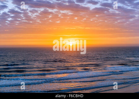 Sunrise over Atlantic ocean with dramatic sky in Florida, aerial view. Stock Photo