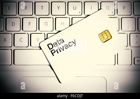 Data Privacy concept. Smart card on the white laptop computer. Stock Photo