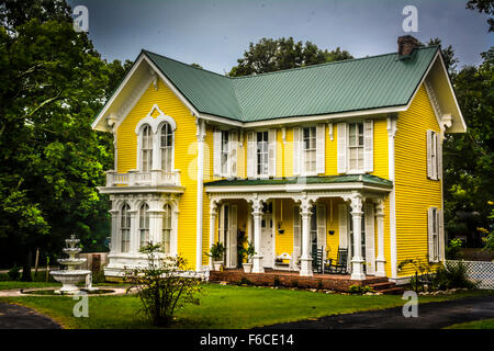 The Wright House, a fanciful two storied Yellow Victorian house built in 1867 accented with gingerbread style in Bolivar, TN Stock Photo