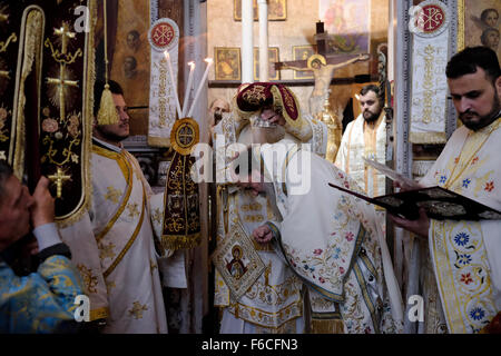 Greek Orthodox Patriarch of Jerusalem Theophilos III taking part in a mass in St George Church in the city of Lod during a feast to commemorates the bringing of the remains of the great martyr St. George to Lod, Israel Stock Photo
