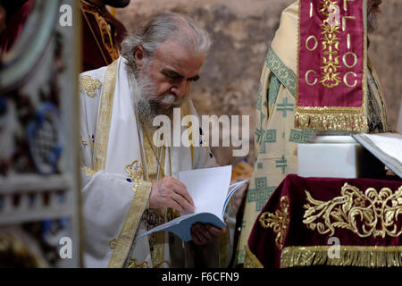 Greek Orthodox Patriarch of Jerusalem Theophilos III takes part in a mass in St George Church in the city of Lod during a feast to commemorates the bringing of the remains of the great martyr St. George to Lod, Israel Stock Photo