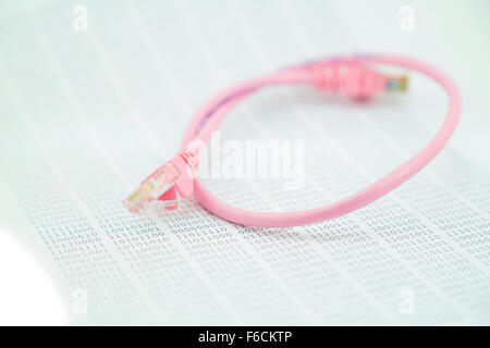 pink network cable against a binary numbers background Stock Photo