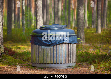 Big refuse bin in forest for tourists. Stock Photo