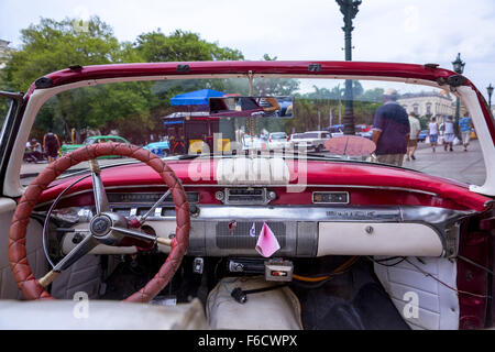 Dashboard of an old Buick, red vintage car cabriolet on the streets, old American road cruiser on the streets, Havana, Cuba, Stock Photo