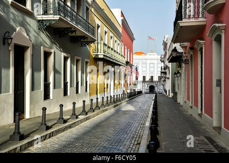 Colorful Spanish Colonial facades and La Fortaleza (Governor's Mansion, Fortaleza Street, Old San Juan, Puerto Rico Stock Photo