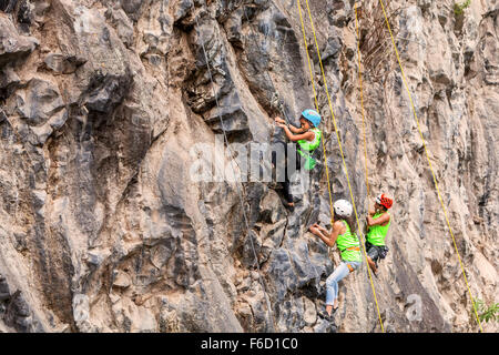 Banos, Ecuador - 30 November 2014: Basalt Challenge Of Tungurahua, Young Group Of Climbers Climbing A Rock Wall In Banos Stock Photo