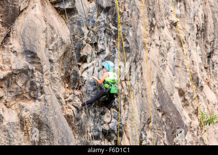 Banos, Ecuador - 30 November 2014: Basalt Challenge Of Tungurahua, Brave Girl Climbing A Rock Wall In Banos On November 30, 2014 Stock Photo