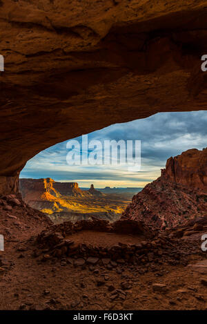 Beautiful golden sunset light falling down the canyon, view from false kiva Canyonlands National Park near Moab Utah United Stat Stock Photo