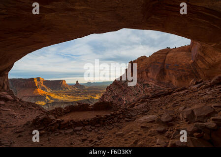 Beautiful golden sunset light falling down the canyon, view from false kiva Canyonlands National Park near Moab Utah United Stat Stock Photo