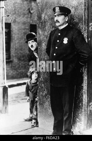 RELEASE DATE: February 6, 1921   MOVIE TITLE: The Kid   STUDIO: First National Pictures   PLOT: The Tramp cares for an abandoned child, but events put that relationship in jeopardy.   PICTURED: CHARLES CHAPLIN as A Tramp, JACKIE COOGAN as The Kid, TOM WILSON. Stock Photo