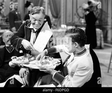 RELEASE DATE: December 6, 1944. MOVIE TITLE: Nothing But Trouble. STUDIO: Metro-Goldwyn-Mayer (MGM). PLOT: Working as chef and butler, the boys wreck a fancy dinner party and, in the process, accidently foil a plot, by enemy agents, to poison a young exiled king. PICTURED: STAN LAUREL as Stan. Stock Photo
