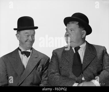 RELEASE DATE: December 6, 1944. MOVIE TITLE: Nothing But Trouble. STUDIO: Metro-Goldwyn-Mayer (MGM). PLOT: Working as chef and butler, the boys wreck a fancy dinner party and, in the process, accidently foil a plot, by enemy agents, to poison a young exiled king. PICTURED: STAN LAUREL as Stan and OLIVER HARDY as Ollie. Stock Photo