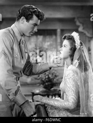 RELEASE DATE: May 17, 1947. MOVIE TITLE: Honeymoon. STUDIO: RKO Radio Pictures. PLOT: Pretty but scatterbrained Barbara Olmstead arrives in Mexico City to marry her soldier fiance, learns he's been delayed, and runs off to find a place to stay. Meanwhile, fiance Phil arrives after all, just misses Barbara, and goes off in quest of her. As further complications ensue, American consul David Flanner (who has an impatient fiancee of his own) is caught in the middle and driven nearly frantic. PICTURED: SHIRLEY TEMPLE as Barbara Olmstead and GUY MADISON as Corporal Phil Vaughn. Stock Photo