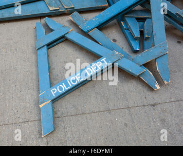 Police Line Do Not Cross. A Police line do not cross police department crime scene sign on the sidewalk in New York City. Stock Photo