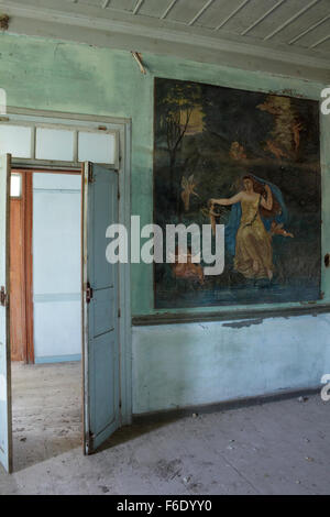 Interior wall, next to the door entrance, hosting the wallpainting entitled 'The spring' (η ανοιξις) by Manos Papamalis. Kontias Stock Photo