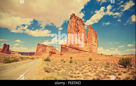 Vintage toned scenic road in Arches National Park, Utah, USA. Stock Photo