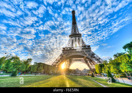 Sunset behind Eiffel Tower, Champ de Mars, Paris, Ile-de-France, France Stock Photo