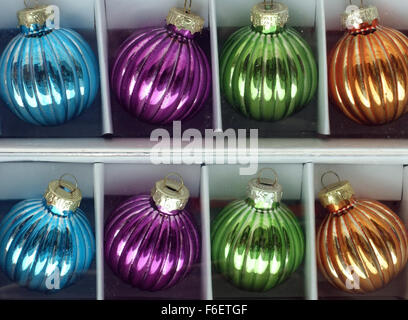 Christmas tree baubles in a box on sale in London shop Stock Photo