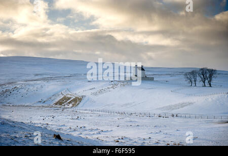 A dusting of winter snow gives Corgarff castle in Aberdeenshire an even more bleak and remote appearance Stock Photo