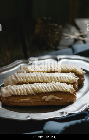 Eclairs in metal plate Stock Photo