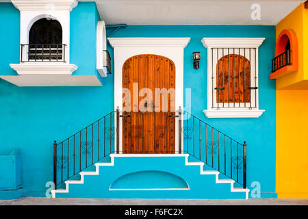 Blue decorated wall and wooden doors and window, Puerto Vallarta, Mexico Stock Photo