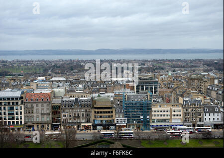 View from Castle Hill across West Princes Street Gardens and the bus busy Princes Street with its colourful shop buildings Stock Photo