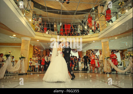 bride and groom dancing in the restaurant on bubbles Stock Photo