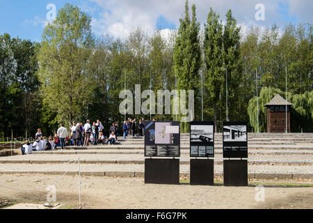 Information boards and tourist group in Auschwitz II-Birkenau German Nazi Concentration and Extermination Camp. Oswiecim, Poland Stock Photo