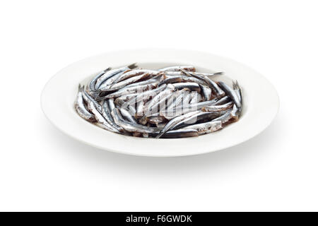 Fresh anchovies prepared seafood without head dish with its shadow on white background Stock Photo