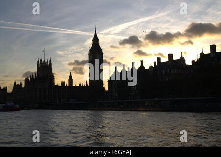 Big Ben and the Houses of Parliament in silhouette at Sunset with River Thames and other Landmarks. Westminster, London UK Stock Photo